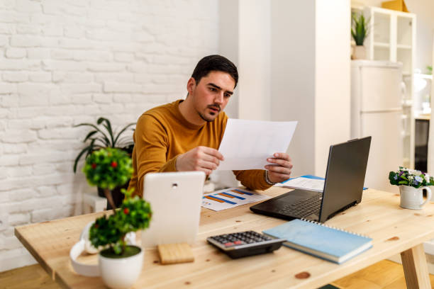 istock A handsome young man is working for a home office during the pandemic time. 1447982453