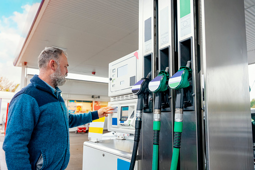 filling gas at a gas station