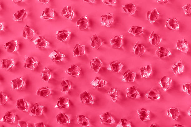 istock Pattern of ice pieces on magenta background 1447993824