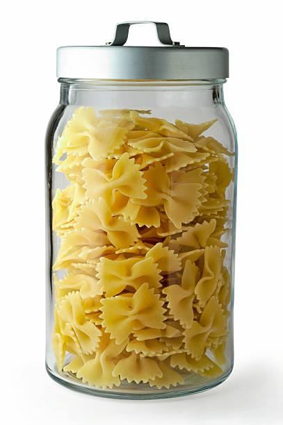 istock Raw pasta in glass jar with clipping path 144799904