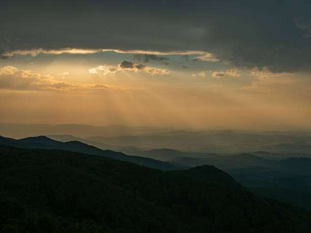 istock Hill silhouettes in mist during sunset 1447999200