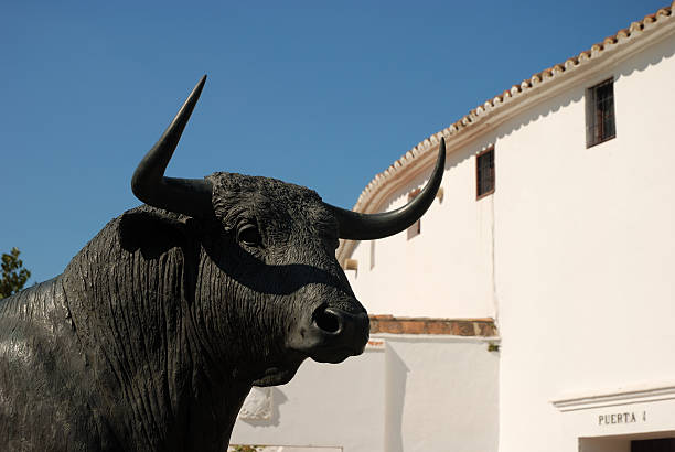 Bull statue in front of the bullfighting arena in Ronda, Spain
