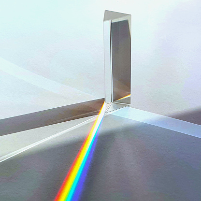 Glass prism on sun light causing light dispersion