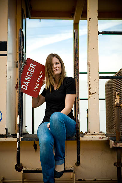 indie woman sitting on train stock photo