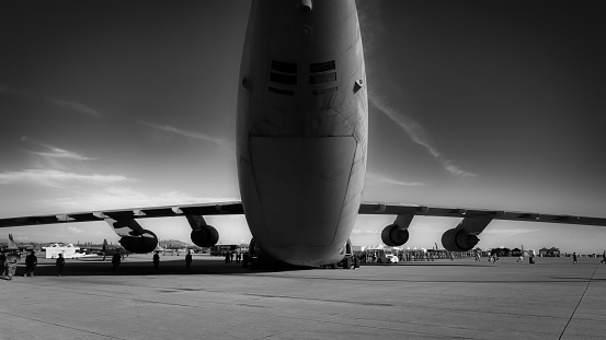 San Diego, California, USA - September 23, 2022: US Marines conduct a FOD Walkdown (Foreign Object Debris) near a C5 Galaxy at the end of the day during the 2022 Miramar Airshow.