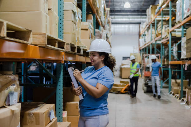 istock Female storage room employee working 1448004765