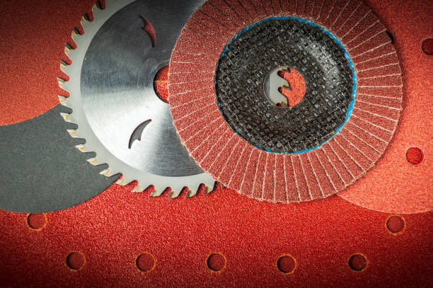 istock Abrasive tools and grinding discs on the background of sandpaper. Tools used by master builders 1448004849