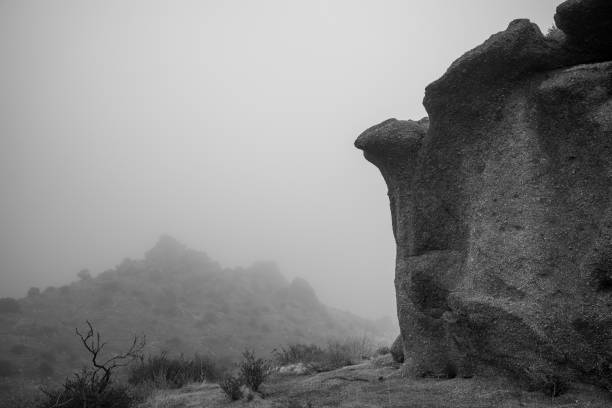istock Massive Boulder in dense fog on sonoran desert mountain 1448007144