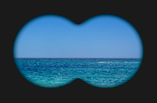 Binocular view of the sea. View binoculars with soft blurry edges.