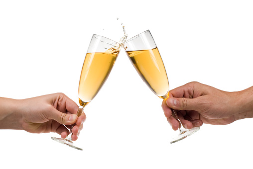 Numerous hands holding champagne flutes with champagne celebratory toast silhouettes