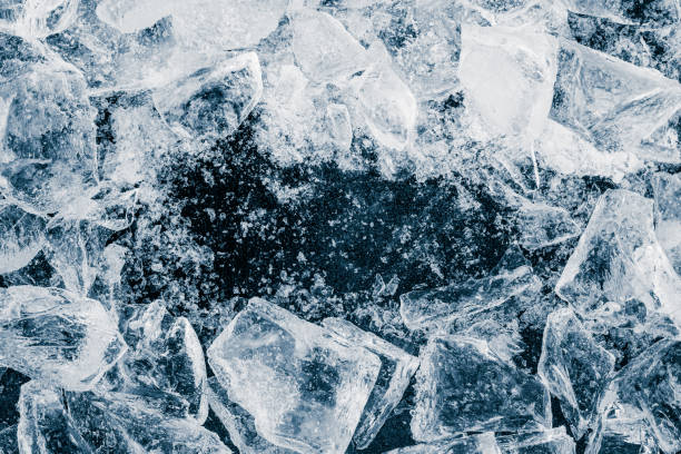 istock Ice cubes crush on black background. Chill backdrop. Frame border, made of ice. 1448008809