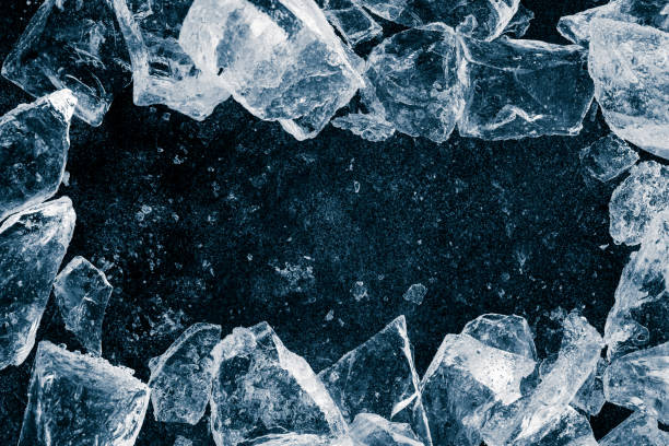 istock Ice cubes crush on black background. Chill backdrop. Frame border, made of ice. 1448008823