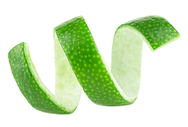 istock Peel of fresh lime over white background. Lime fruit zest. 1448012418