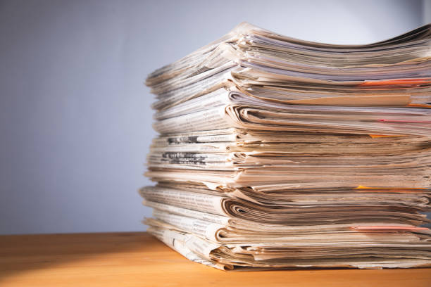 Pile of papers on a wooden table