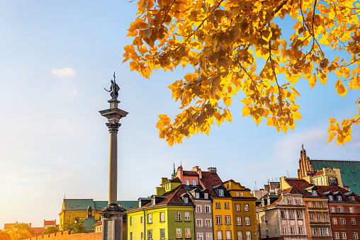 Column in Old Town of Warsaw at autumn sunset, Poland