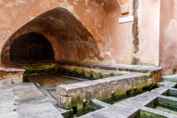 Lavatoio Medievale Fiume Cefalino, a Medieval wash house in the old town of Cefalu, Sicily, Italy Lavatoio Medievale Fiume Cefalino, a Medieval wash house in the old town of Cefalu, Sicily, Italy cefalu stock pictures, royalty-free photos & images