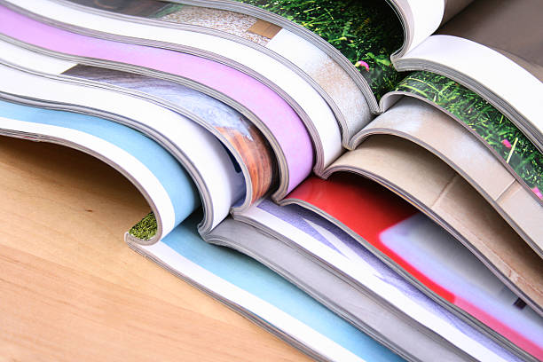 istock Eight open magazines on top of each other 144801588