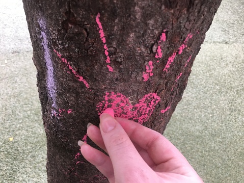 Drawing of a heart with bright pink chalk