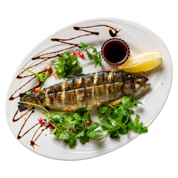 istock grilled trout on a white plate isolated on white background top view 1448016799
