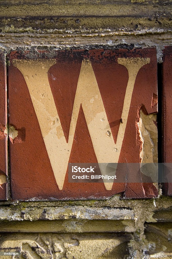 Alphabet Series Letter W A found letter from a Victorian terracotta tile.  Alphabet Stock Photo