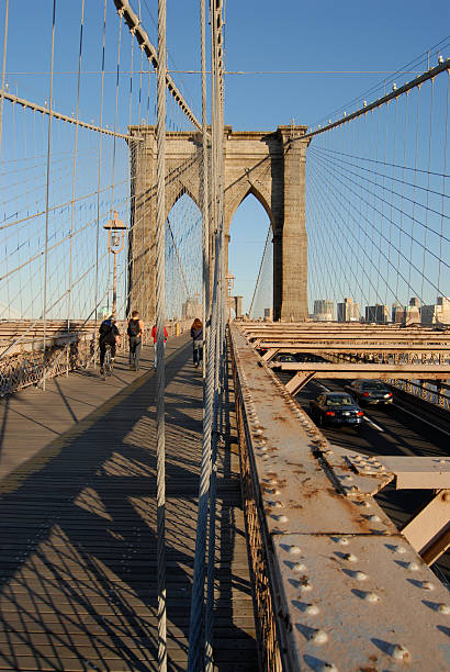 istock Cars and people crossing Brooklyn Bridge 144802004