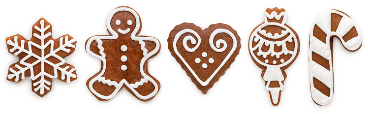 A selection of gingerbread cookies for Christmas. \n- Gingerbread snowflake\n- Gingerbread man\n- Gingerbread heart\n- Gingerbread ornament\n- Gingerbread candy cane\n\nIsolated on white.