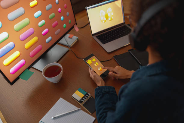 istock Woman graphic designer is using smartphone during work day in home office 1448020147