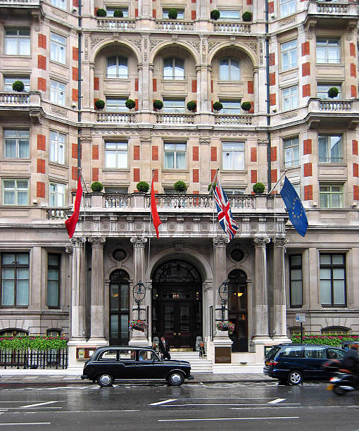 An ornate luxury hotel on a rainy day.