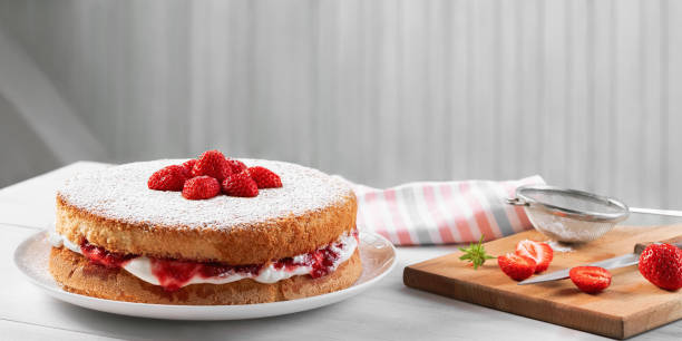 istock Two-layer Victoria cake with whipped cream, strawberry jam and fresh berries 1448024339