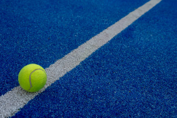 istock blue paddle tennis court and a ball 1448026367