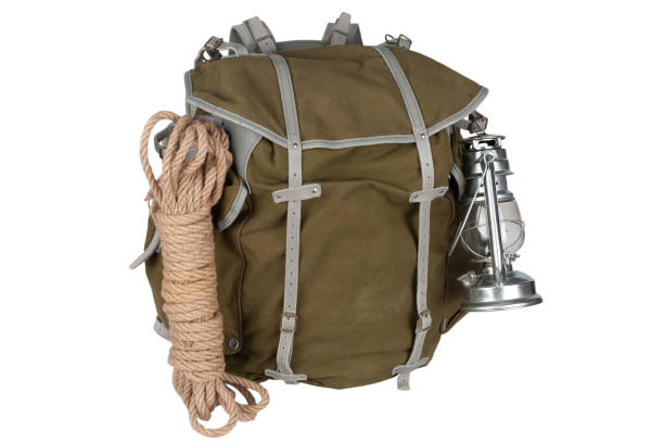 istock Antique vintage backpack with rope, teapot, brass mug and gas lantern 1448027257