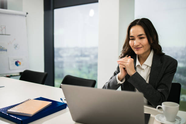 istock Businesswoman working in a modern office 1448027491