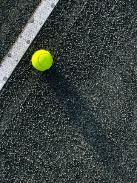 istock Tennis ball on a clay court 1448029613