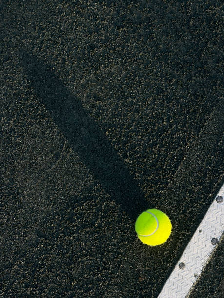 istock Tennis ball on a clay court 1448029615