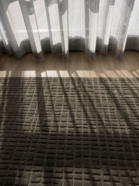 istock Sun light shining through a curtain in a room 1448029646