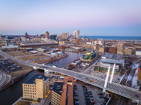 Aerial View of Downtown Milwaukee at dusk viewed from the West. Highway and Power Plant in foreground