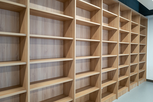 Empty wooden square bookcase in library