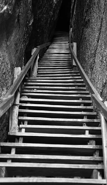Stairway up a rock crevice. Black and White.