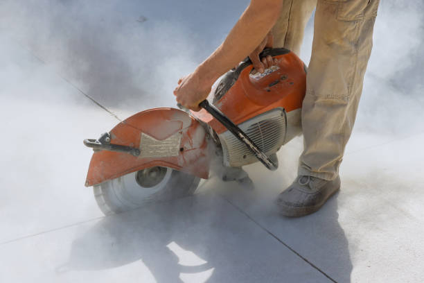 istock Diamond blade saws are used by construction workers to cut concrete sidewalks 1448033126