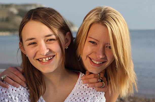 istock Fun on the beach for two young girls 144803378
