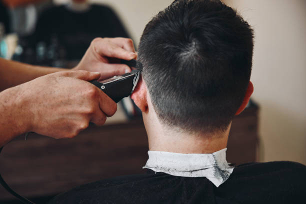istock Barber shaving caucasian man in barber shop 1448037183