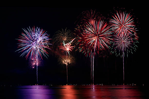 istock Colorful Firework Show Finale over Water 144804253