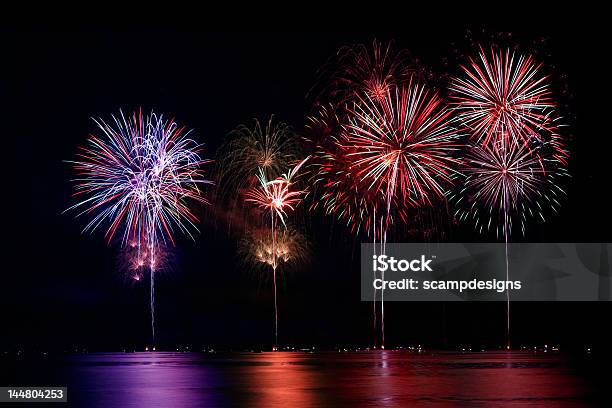 Colorful Firework Show Finale Over Water Stock Photo - Download Image Now - Beauty, Black Background, Bright