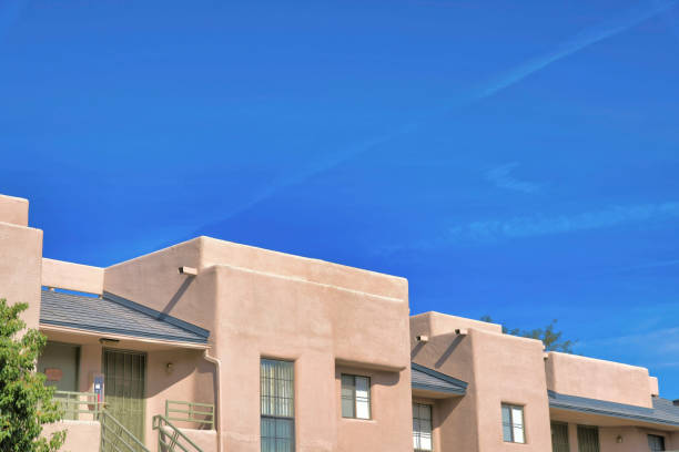 istock Mediterranean townhomes with flat roofs structure and green front doors and railings- Tucson, AZ 1448043104