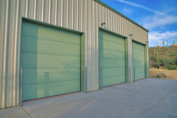 istock Three green garage doors with concerete driveway in Tucson, Arizona 1448043214