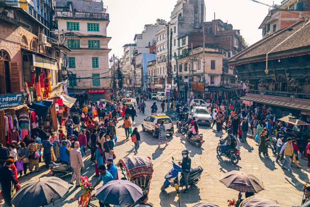 High traffic area by Durbar Square, Kathmandu, Nepal Kathmandu, Nepal - November 6 2022: Busy street traffic by Akash Bhairab Temple near Durbar Square thamel stock pictures, royalty-free photos & images