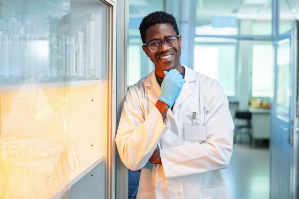 istock Young African-American Scientist Standing In Laboratory 1448043400