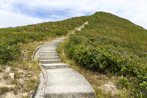 Steep Footpath, Staircase to Mountain peak, Hillock, Mountain Top as Abstract Background. Concept of Hiking, Climbing