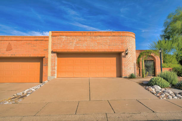 istock Two garage doors with wall bricks at Tucson, Arizona 1448046232
