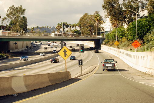 Drive onto the 101 Freeway from this entrance ramp in Los Angeles, California.  Advertising space is on the back of the pick up truck as well.